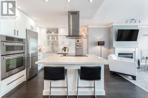 Ph404 - 88 Palace Pier Court, Toronto (Mimico), ON - Indoor Photo Showing Kitchen With Fireplace With Upgraded Kitchen