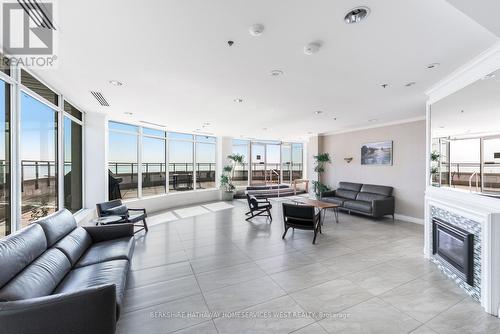 Ph404 - 88 Palace Pier Court, Toronto (Mimico), ON - Indoor Photo Showing Living Room With Fireplace