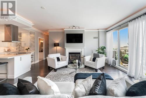 Ph404 - 88 Palace Pier Court, Toronto (Mimico), ON - Indoor Photo Showing Living Room With Fireplace