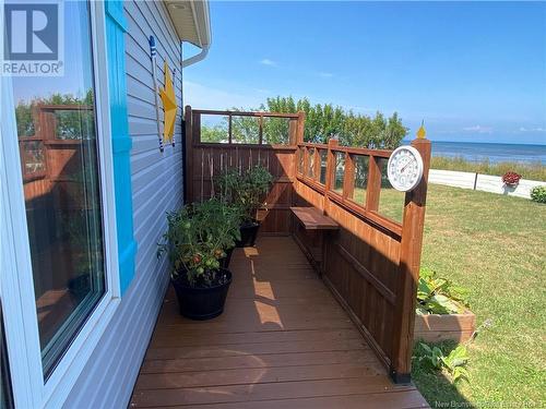 39 Normandie E, Petit-Rocher, NB - Outdoor With Body Of Water With Deck Patio Veranda With Exterior