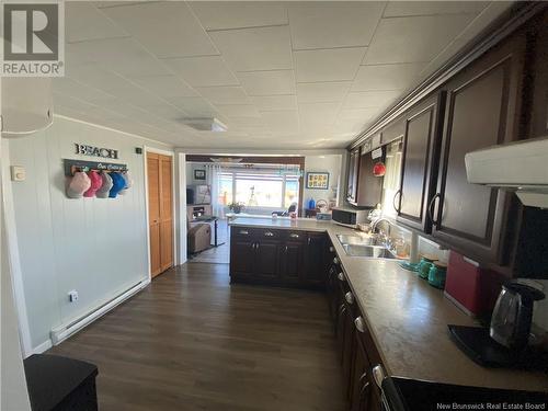 39 Normandie E, Petit-Rocher, NB - Indoor Photo Showing Kitchen With Double Sink