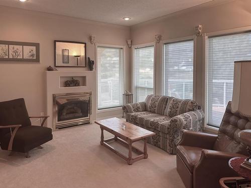 101-45 Hudsons Bay Trail, Kamloops, BC - Indoor Photo Showing Living Room With Fireplace