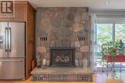 3374 Elm Tree Road, Kawartha Lakes, ON - Indoor Photo Showing Living Room With Fireplace