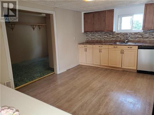 Kitchen and entry to laundry room/Back door - 63 Pine Street, Cornwall, ON - Indoor Photo Showing Kitchen With Double Sink