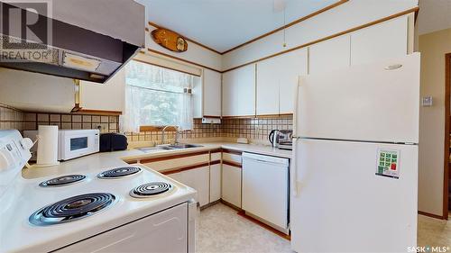 56 Atchison Crescent, Regina, SK - Indoor Photo Showing Kitchen With Double Sink