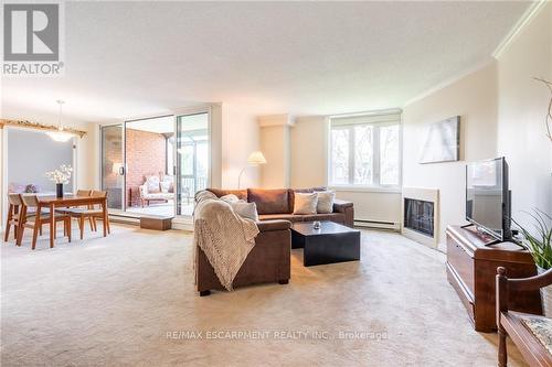 305 - 150 Wilson Street W, Hamilton (Ancaster), ON - Indoor Photo Showing Living Room With Fireplace