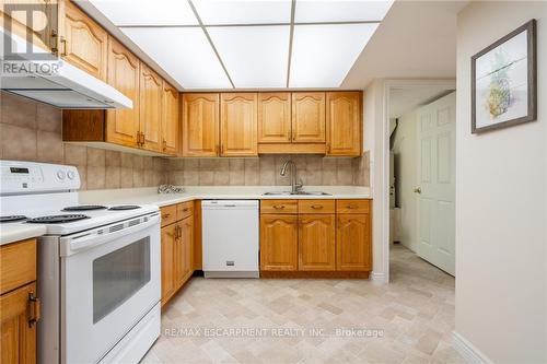 305 - 150 Wilson Street W, Hamilton (Ancaster), ON - Indoor Photo Showing Kitchen With Double Sink