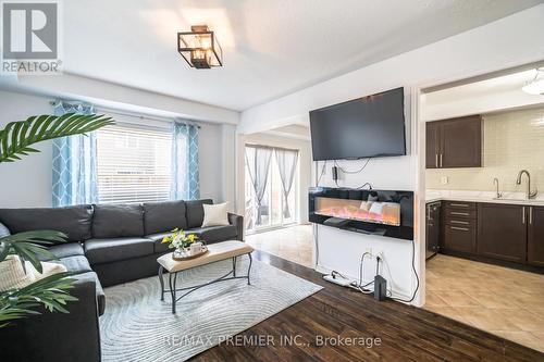 20 - 8 Bradley Avenue N, Hamilton (Binbrook), ON - Indoor Photo Showing Living Room With Fireplace