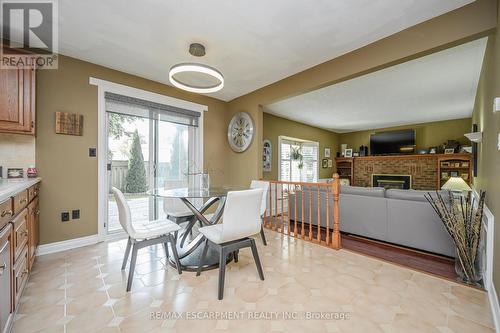 7102 Burbank Crescent, Niagara Falls, ON - Indoor Photo Showing Dining Room With Fireplace