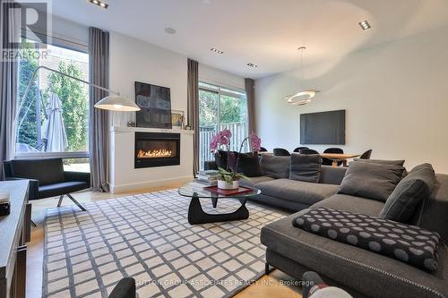 22 Mitchell Avenue, Toronto (Niagara), ON - Indoor Photo Showing Living Room With Fireplace