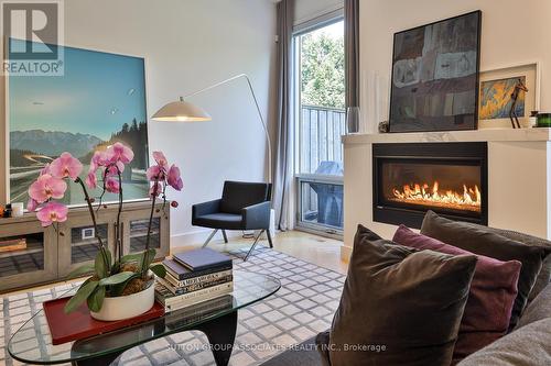 22 Mitchell Avenue, Toronto (Niagara), ON - Indoor Photo Showing Living Room With Fireplace