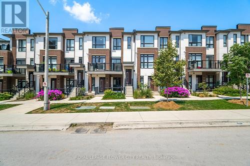 210 - 100 Canon Jackson Drive, Toronto (Brookhaven-Amesbury), ON - Outdoor With Balcony With Facade