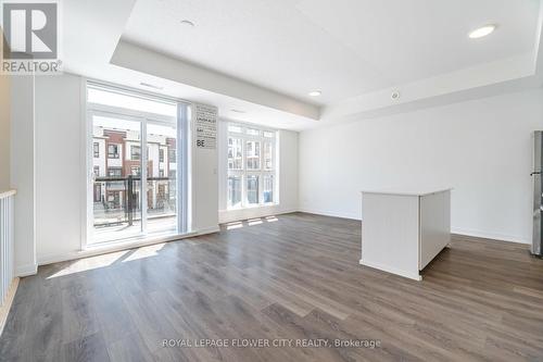 210 - 100 Canon Jackson Drive, Toronto (Brookhaven-Amesbury), ON - Indoor Photo Showing Other Room With Fireplace