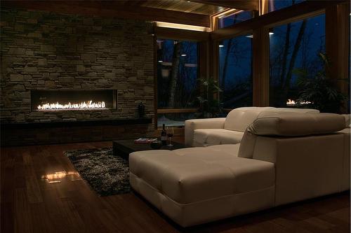 61 South Bay Drive, Onanole, MB - Indoor Photo Showing Living Room With Fireplace