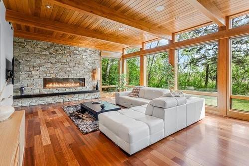 61 South Bay Drive, Onanole, MB - Indoor Photo Showing Living Room With Fireplace