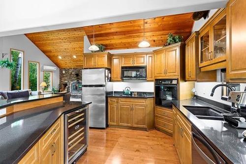 61 South Bay Drive, Onanole, MB - Indoor Photo Showing Kitchen With Double Sink