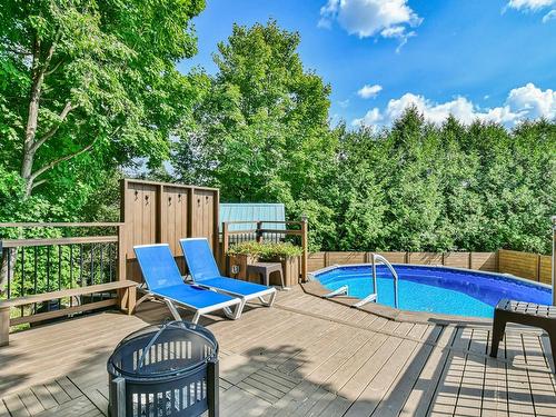 Piscine - 585 Rue De Ronchamp, Sainte-Adèle, QC - Outdoor With Above Ground Pool With Deck Patio Veranda