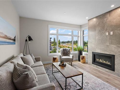 203-2520 Hackett Cres, Central Saanich, BC - Indoor Photo Showing Living Room With Fireplace