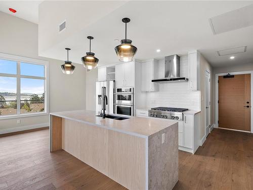 103-2520 Hackett Cres, Central Saanich, BC - Indoor Photo Showing Kitchen With Double Sink With Upgraded Kitchen