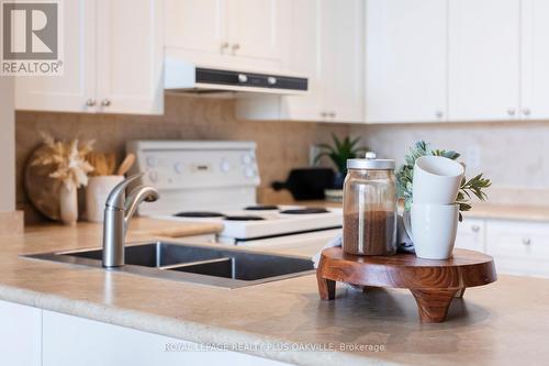 608 - 70 Port Street E, Mississauga (Port Credit), ON - Indoor Photo Showing Kitchen With Double Sink