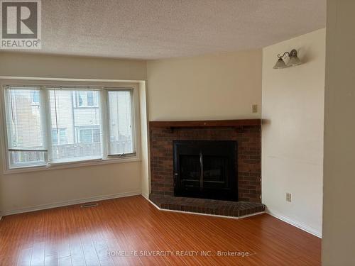 40 - 2275 Credit Valley Road, Mississauga, ON - Indoor Photo Showing Living Room With Fireplace