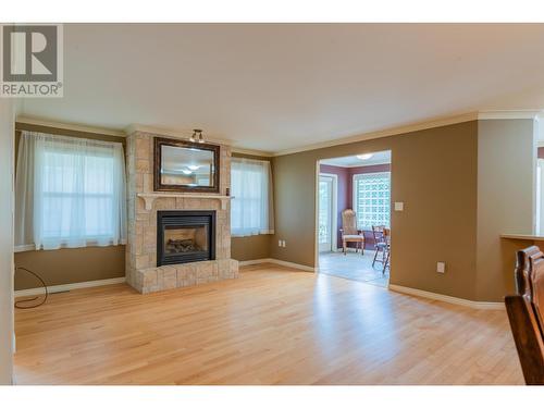 7200 Devito  Drive, Trail, BC - Indoor Photo Showing Living Room With Fireplace