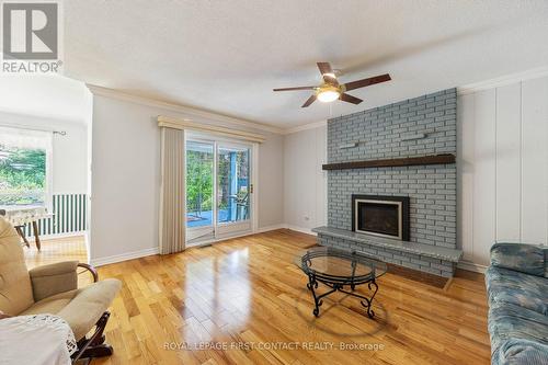 51 Idlewood Drive, Springwater (Midhurst), ON - Indoor Photo Showing Living Room With Fireplace