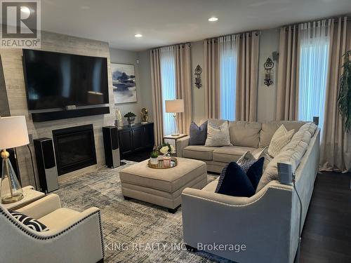 138 Ulster Street, Lasalle, ON - Indoor Photo Showing Living Room With Fireplace