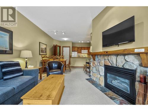 102-3190 Creekside Way, Sun Peaks, BC - Indoor Photo Showing Living Room With Fireplace