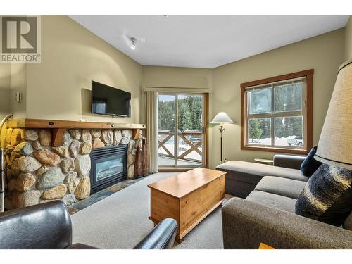 102-3190 Creekside Way, Sun Peaks, BC - Indoor Photo Showing Living Room With Fireplace