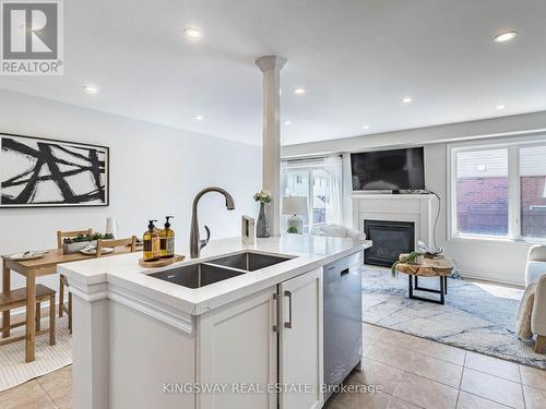 4885 Capri Crescent, Burlington (Alton), ON - Indoor Photo Showing Kitchen With Fireplace With Double Sink