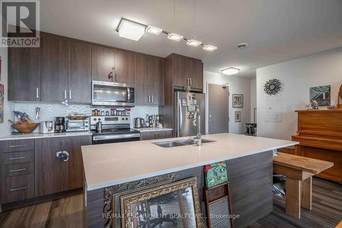 506 - 467 Charlton Avenue E, Hamilton (Stinson), ON - Indoor Photo Showing Kitchen With Stainless Steel Kitchen With Double Sink With Upgraded Kitchen