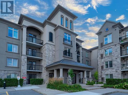 110 - 1440 Main Street E, Milton (Dempsey), ON - Outdoor With Balcony With Facade