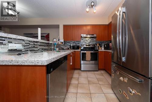 110 - 1440 Main Street E, Milton (Dempsey), ON - Indoor Photo Showing Kitchen With Stainless Steel Kitchen