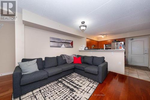 110 - 1440 Main Street E, Milton (Dempsey), ON - Indoor Photo Showing Living Room