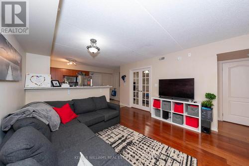 110 - 1440 Main Street E, Milton (Dempsey), ON - Indoor Photo Showing Living Room