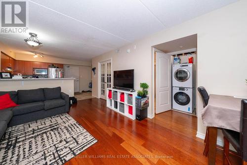 110 - 1440 Main Street E, Milton (Dempsey), ON - Indoor Photo Showing Living Room