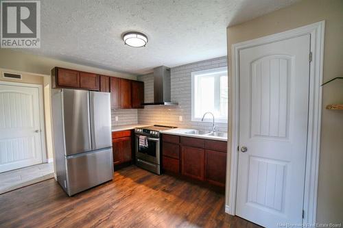 250 Raymond, Bathurst, NB - Indoor Photo Showing Kitchen With Double Sink