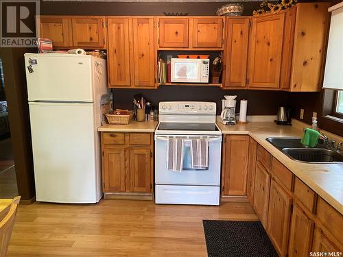 3 Pickerel Street, Greenwater Provincial Park, SK - Indoor Photo Showing Kitchen With Double Sink