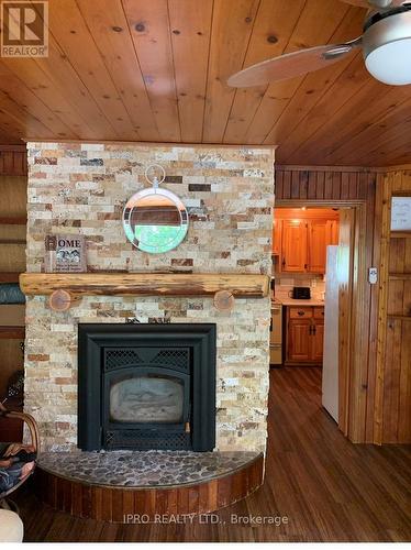 27 Balmoral Avenue, Tiny, ON - Indoor Photo Showing Living Room With Fireplace