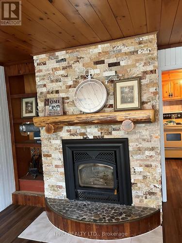 27 Balmoral Avenue, Tiny, ON - Indoor Photo Showing Living Room With Fireplace