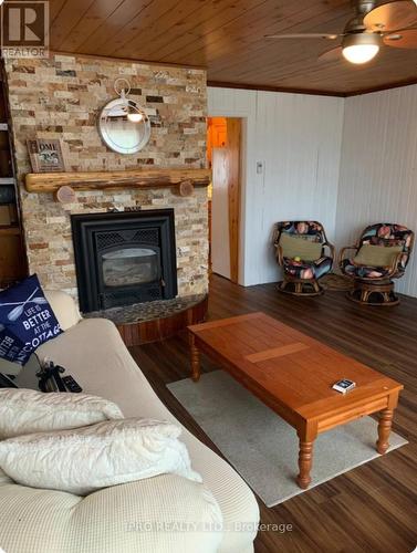 27 Balmoral Avenue, Tiny, ON - Indoor Photo Showing Living Room With Fireplace