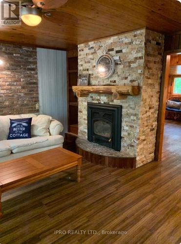 27 Balmoral Avenue, Tiny, ON - Indoor Photo Showing Living Room With Fireplace