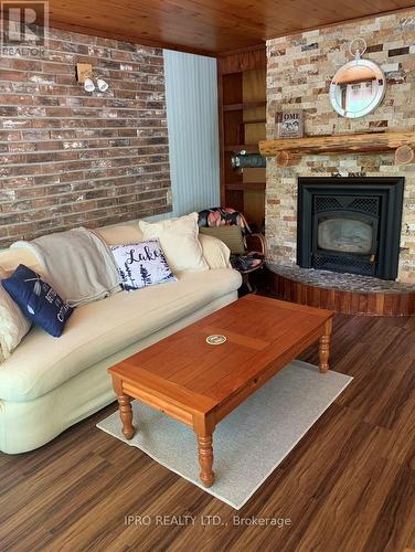 27 Balmoral Avenue, Tiny, ON - Indoor Photo Showing Living Room With Fireplace