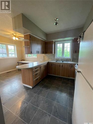 610 Albert Street, Hudson Bay, SK - Indoor Photo Showing Kitchen With Double Sink