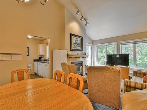 Vue d'ensemble - 1067 Crois. Des Soleils, Mont-Tremblant, QC - Indoor Photo Showing Dining Room With Fireplace