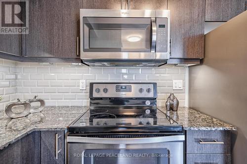 210 - 80 Orchid Place Drive E, Toronto (Malvern), ON - Indoor Photo Showing Kitchen With Upgraded Kitchen