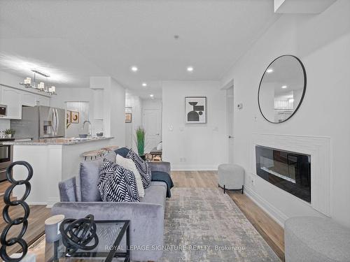 122-10 Mendelssohn St, Toronto, ON - Indoor Photo Showing Living Room With Fireplace