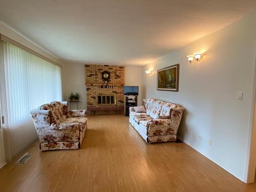 2705 5Th Avenue, Castlegar, BC - Indoor Photo Showing Living Room With Fireplace