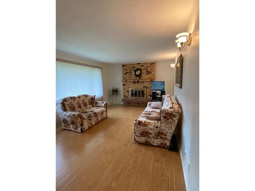 2705 5Th Avenue, Castlegar, BC - Indoor Photo Showing Living Room With Fireplace